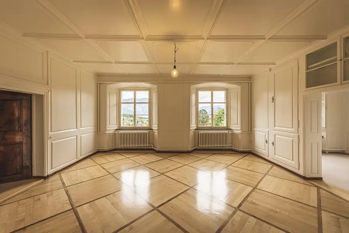Triple-laser projector casting a bright image in a lit room