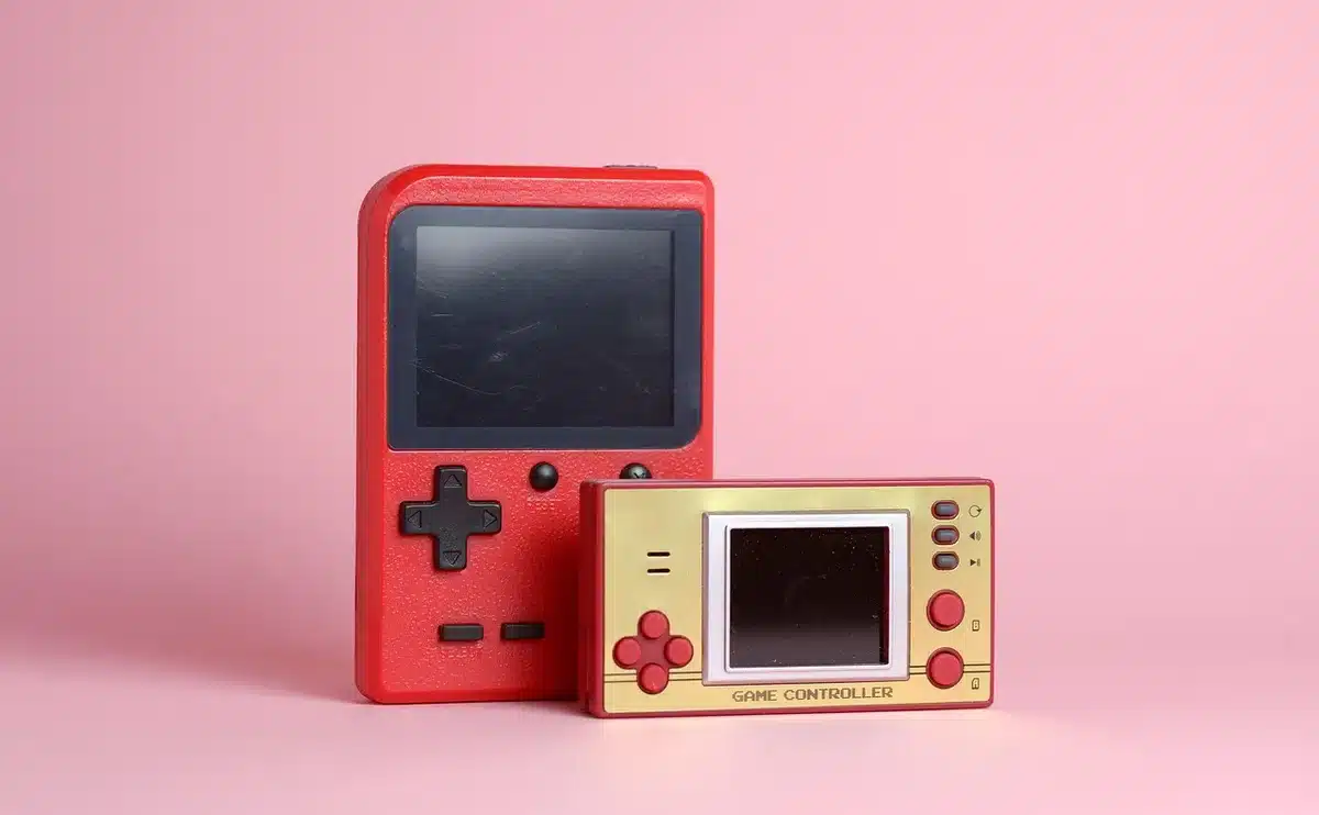 Compact camcorder-style thermal viewer with flip-out touchscreen in hand