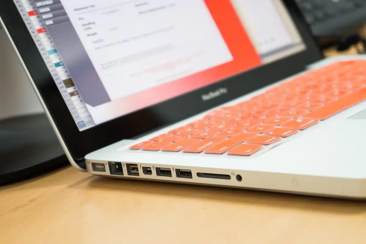 Beige low-profile computer on a table showing HDMI and USB ports