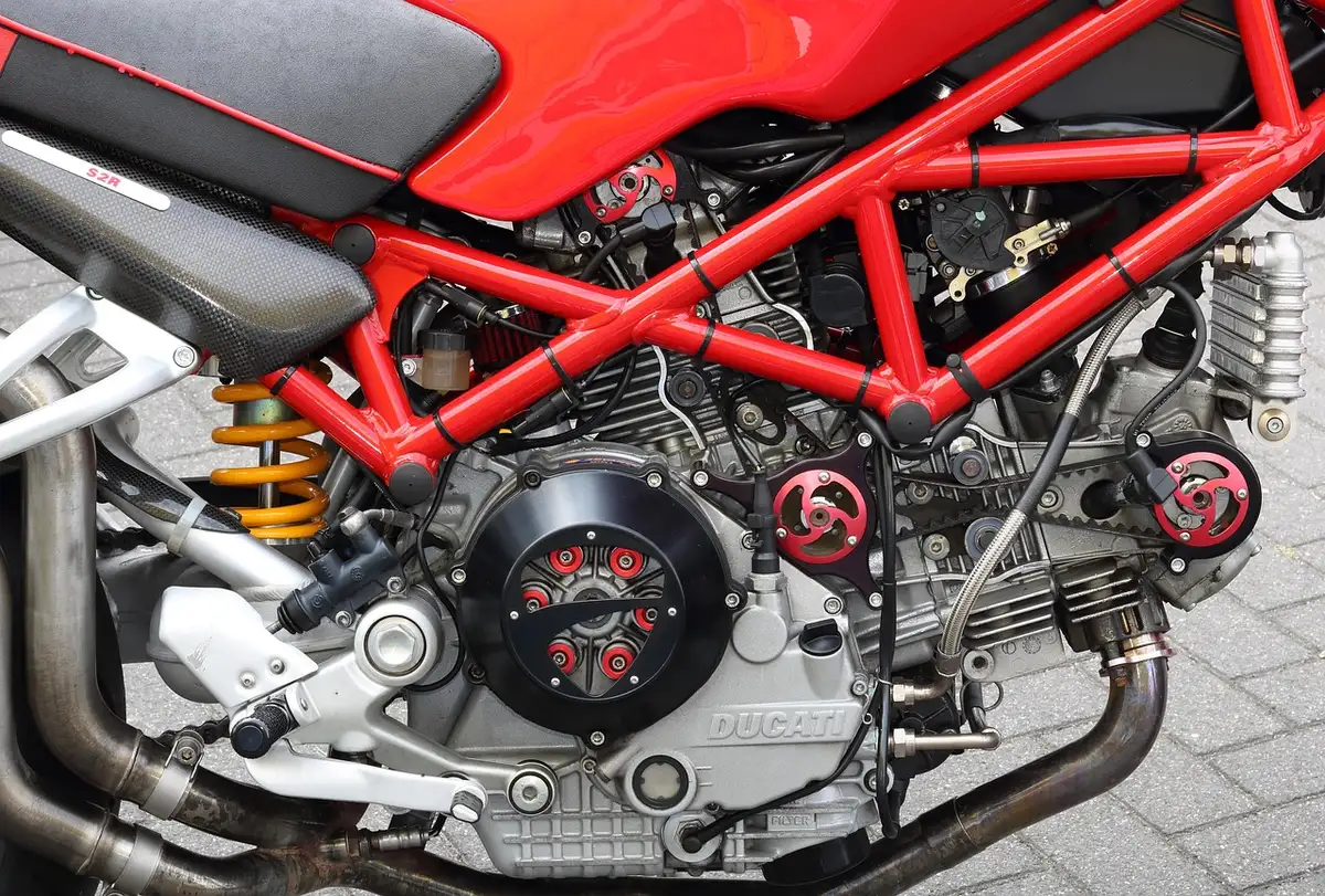 Close-up of 43mm front forks and rear monoshock on a sport-touring motorcycle