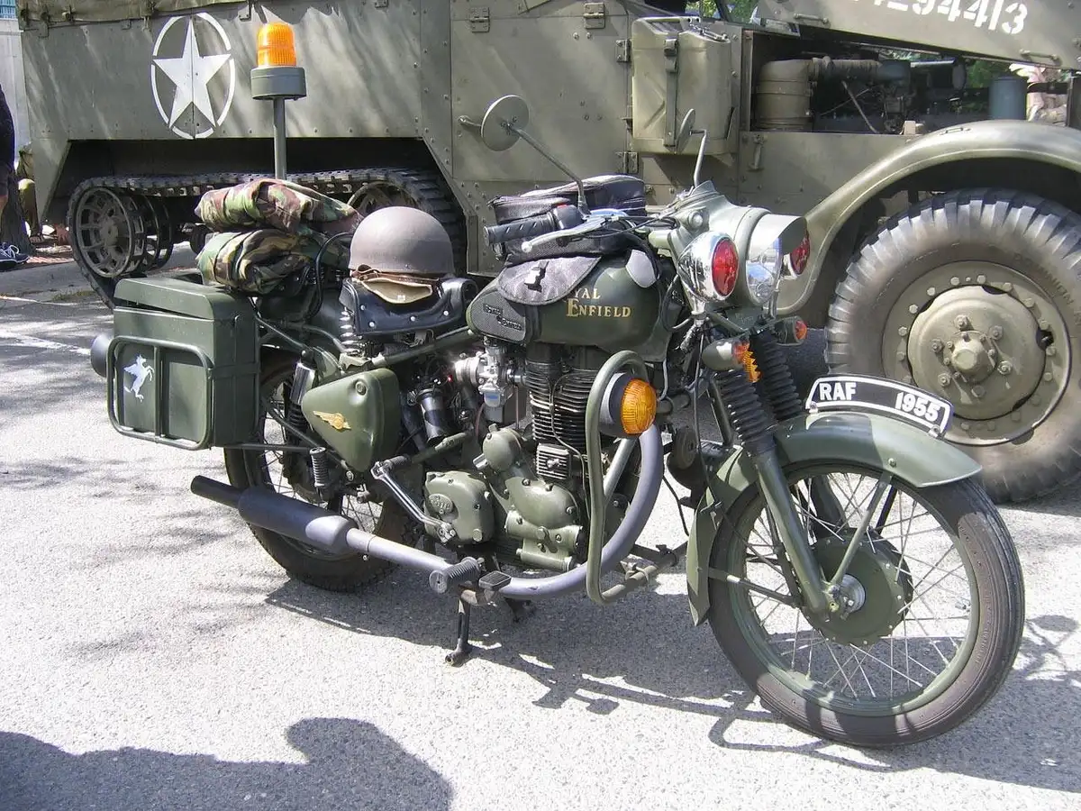 Workshop with a mid-size twin motorcycle being customized