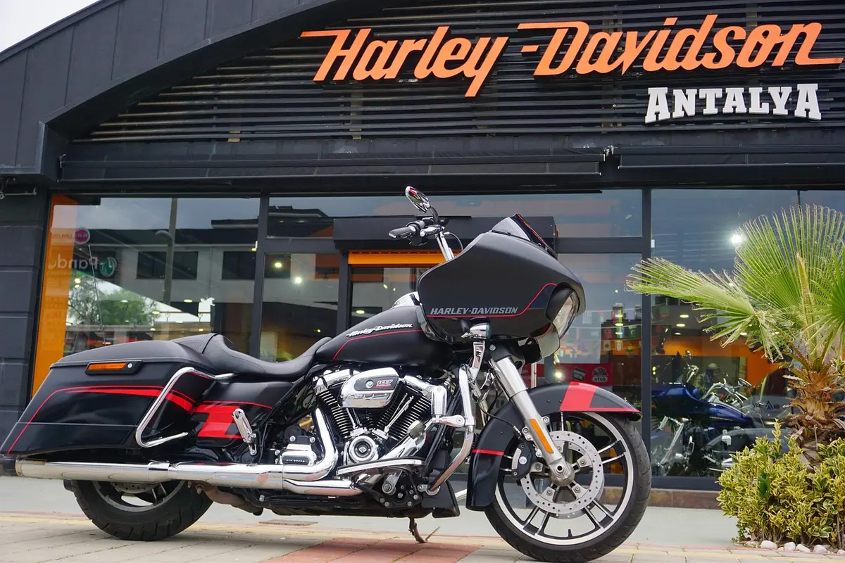 Baggers lined up in a paddock at a racing event
