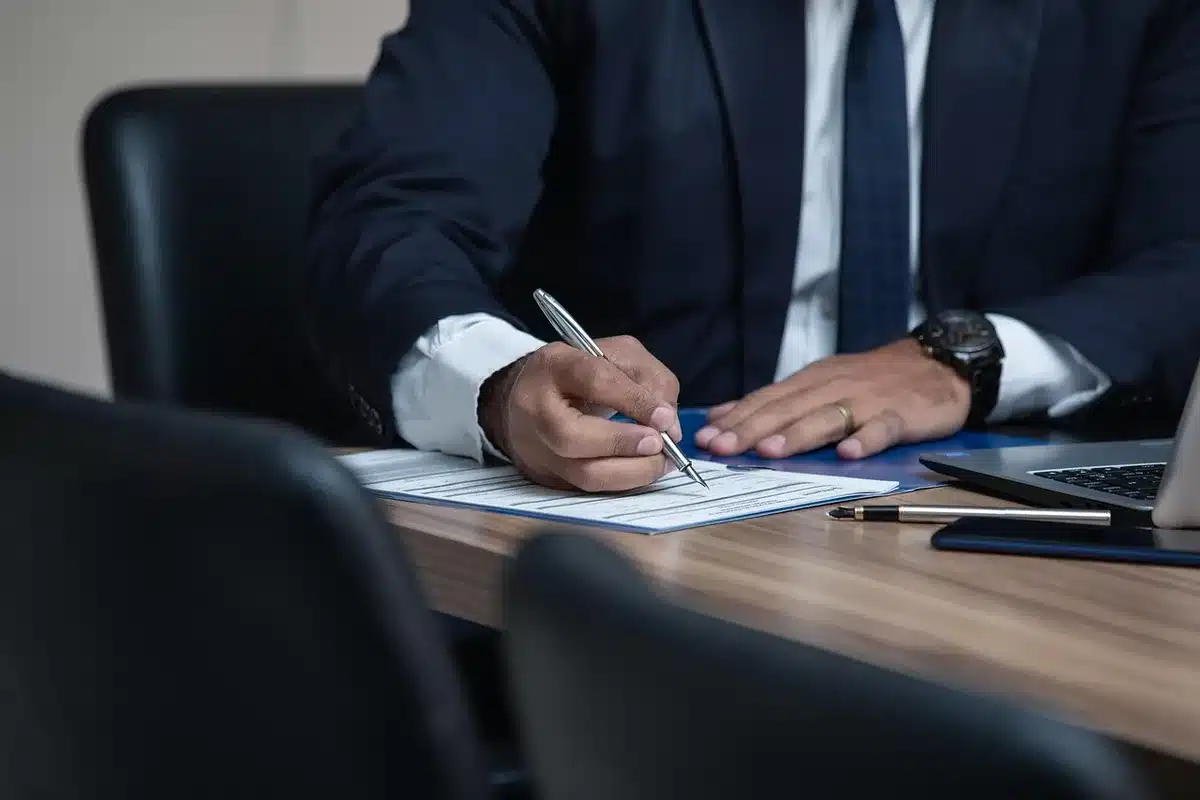 Close-up of an application form and legal documents on a desk