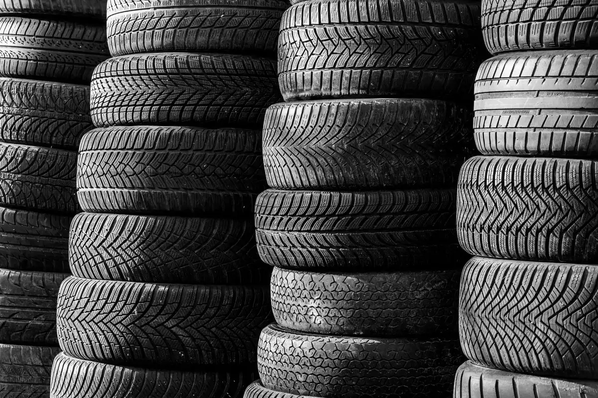 Close-up of a motorcycle tire showing tread grooves and compound zones