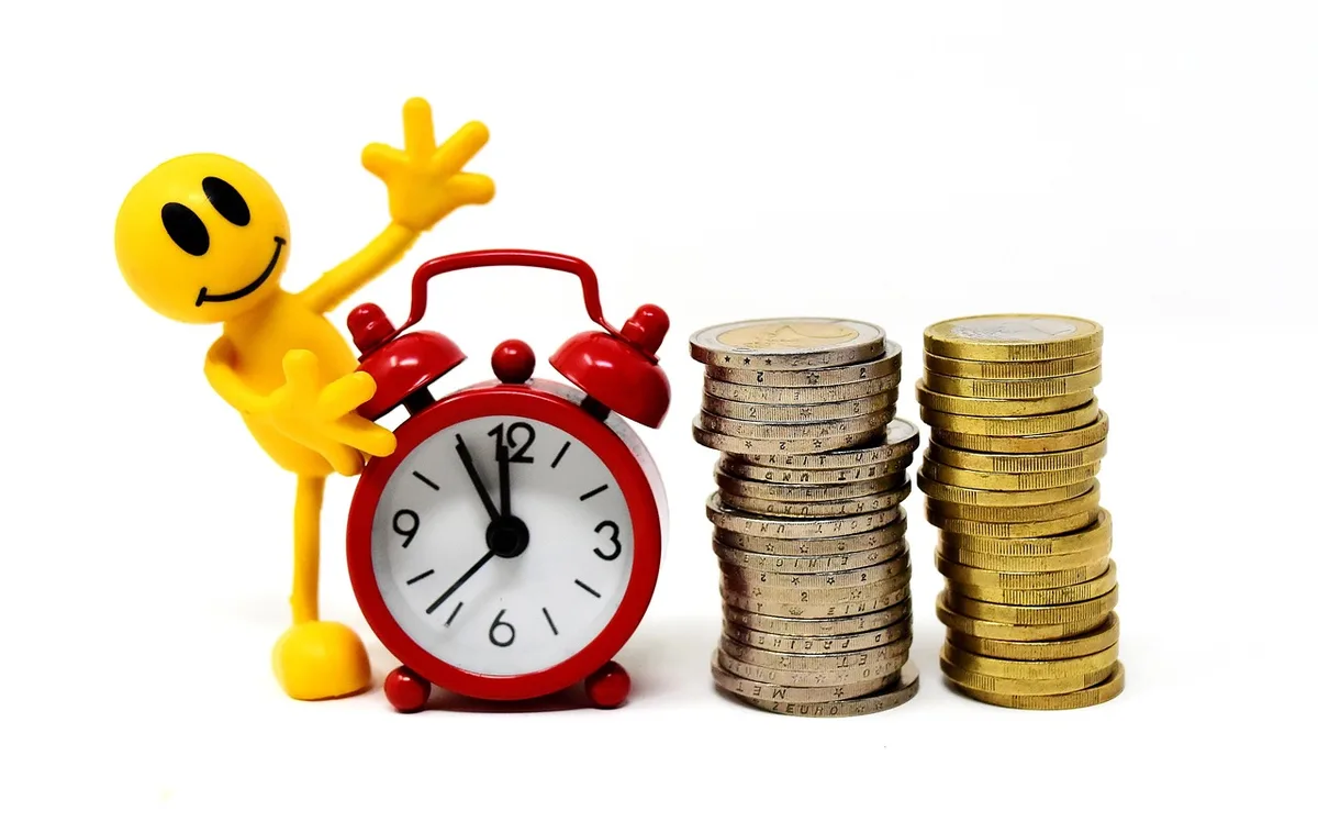 Stack of coins and a calendar showing event dates