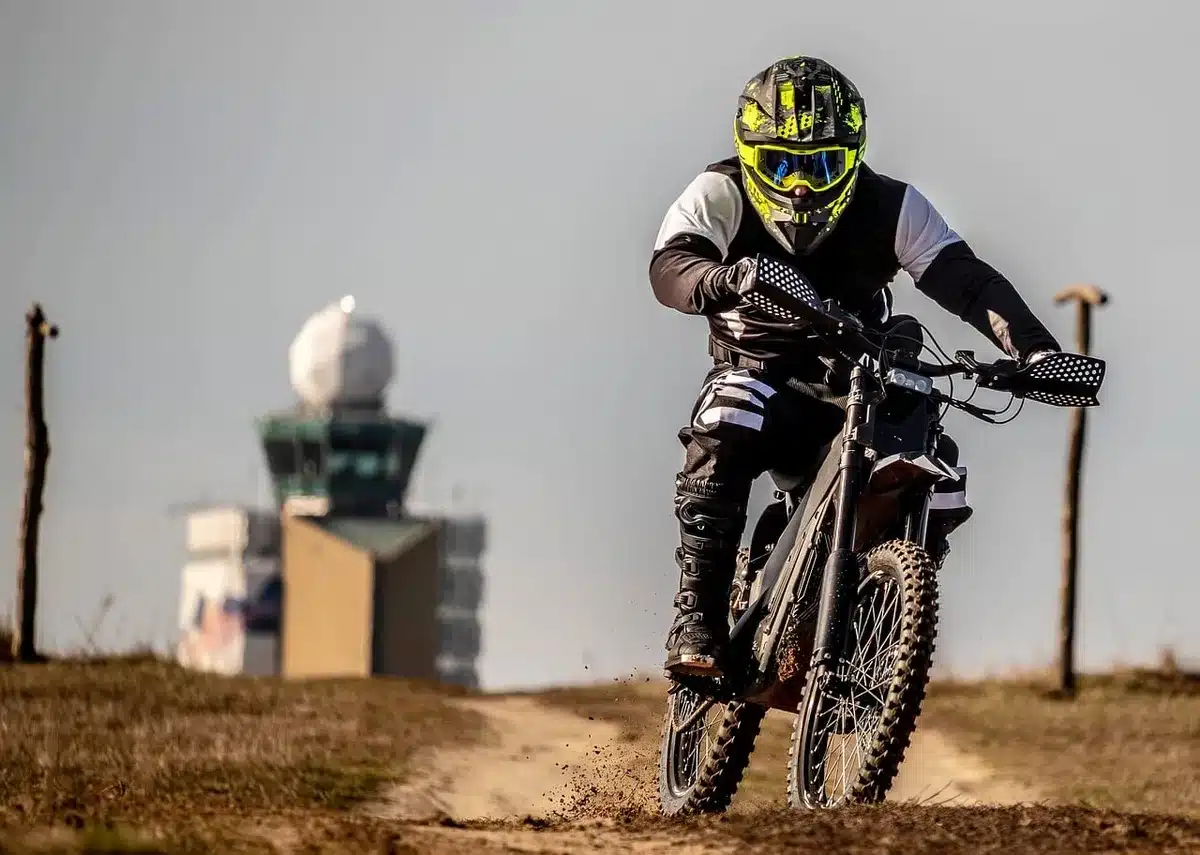Two racing motorcycles battling for position on a track