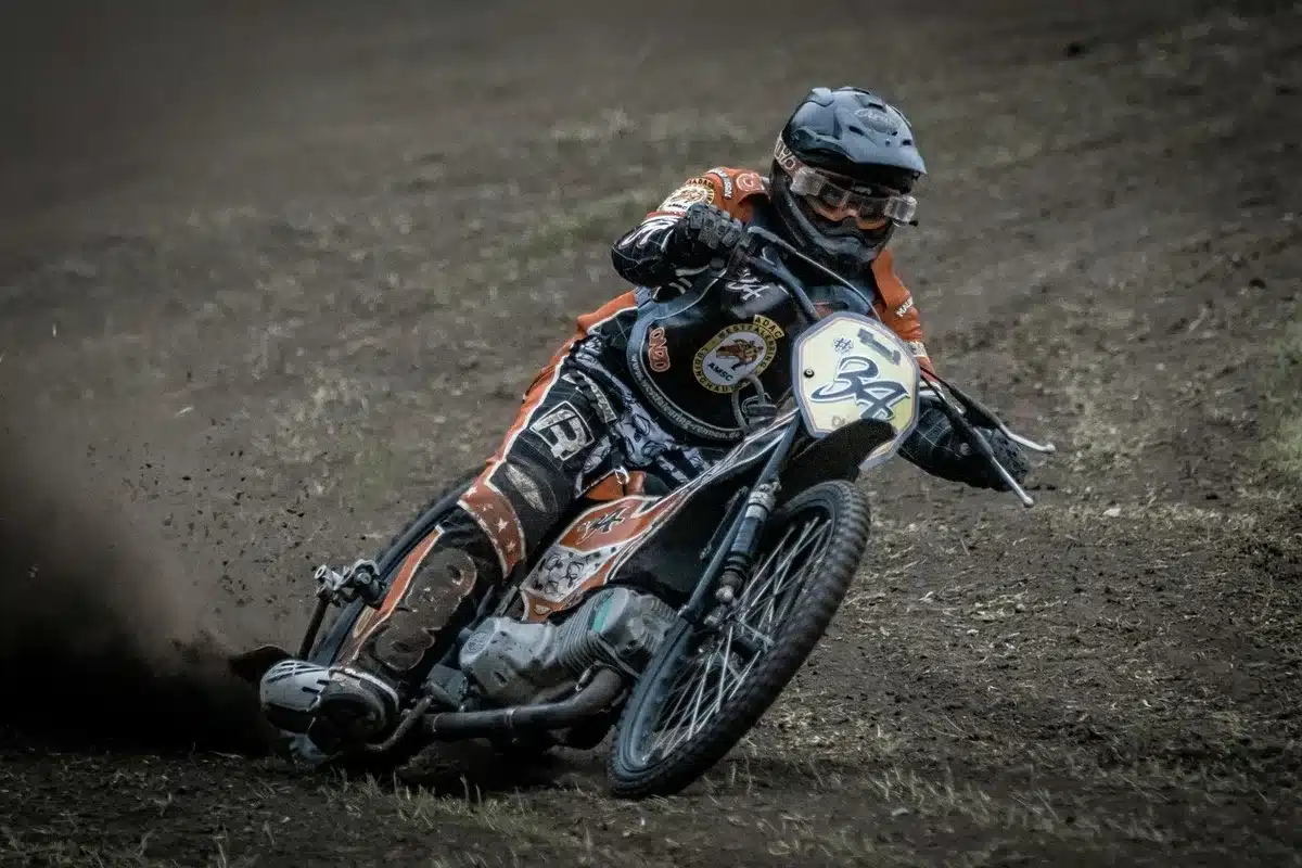 Photo finish between two anonymous motorcycles at an oval track