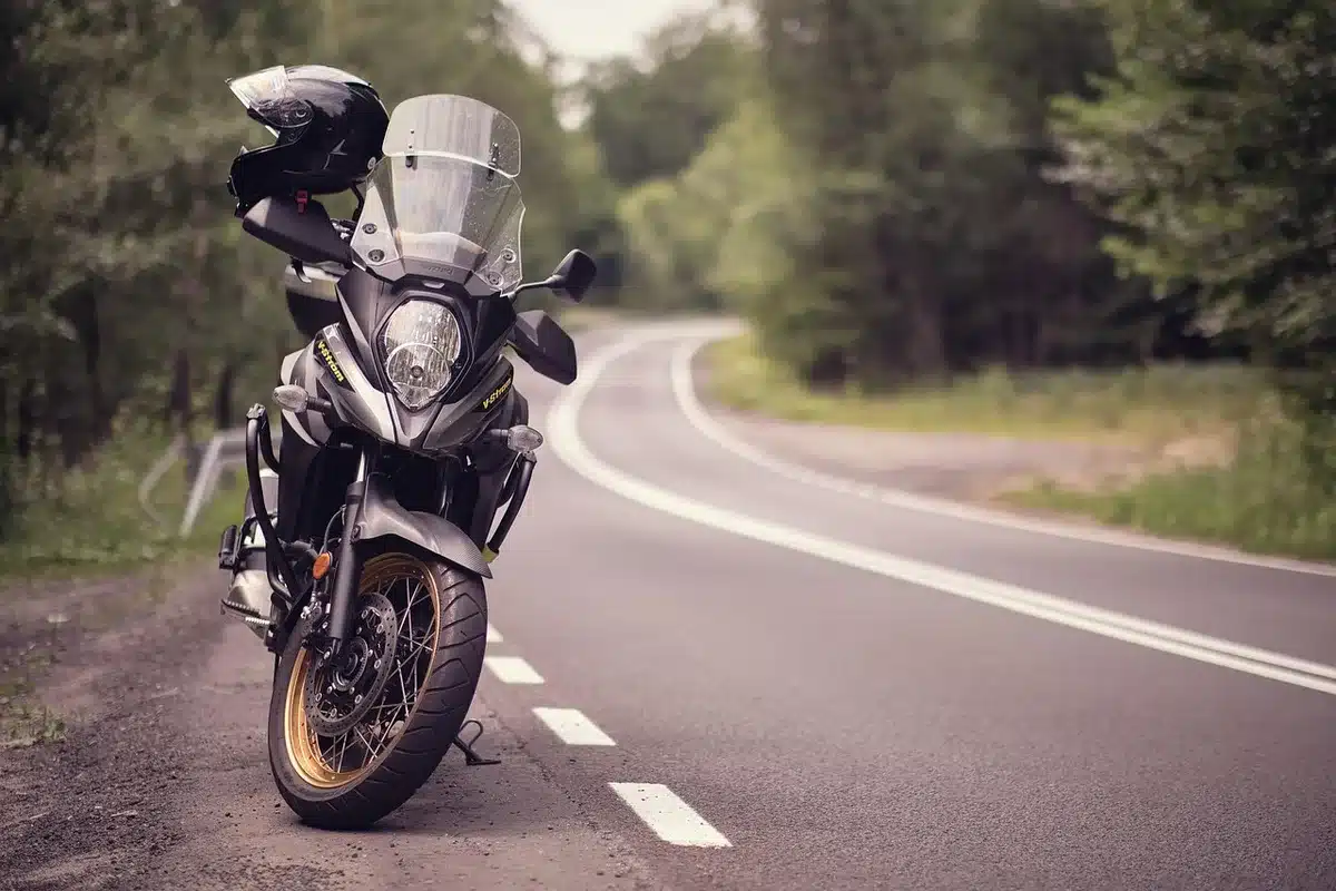 A line of motorcycles with riders wearing helmets, implying group communication