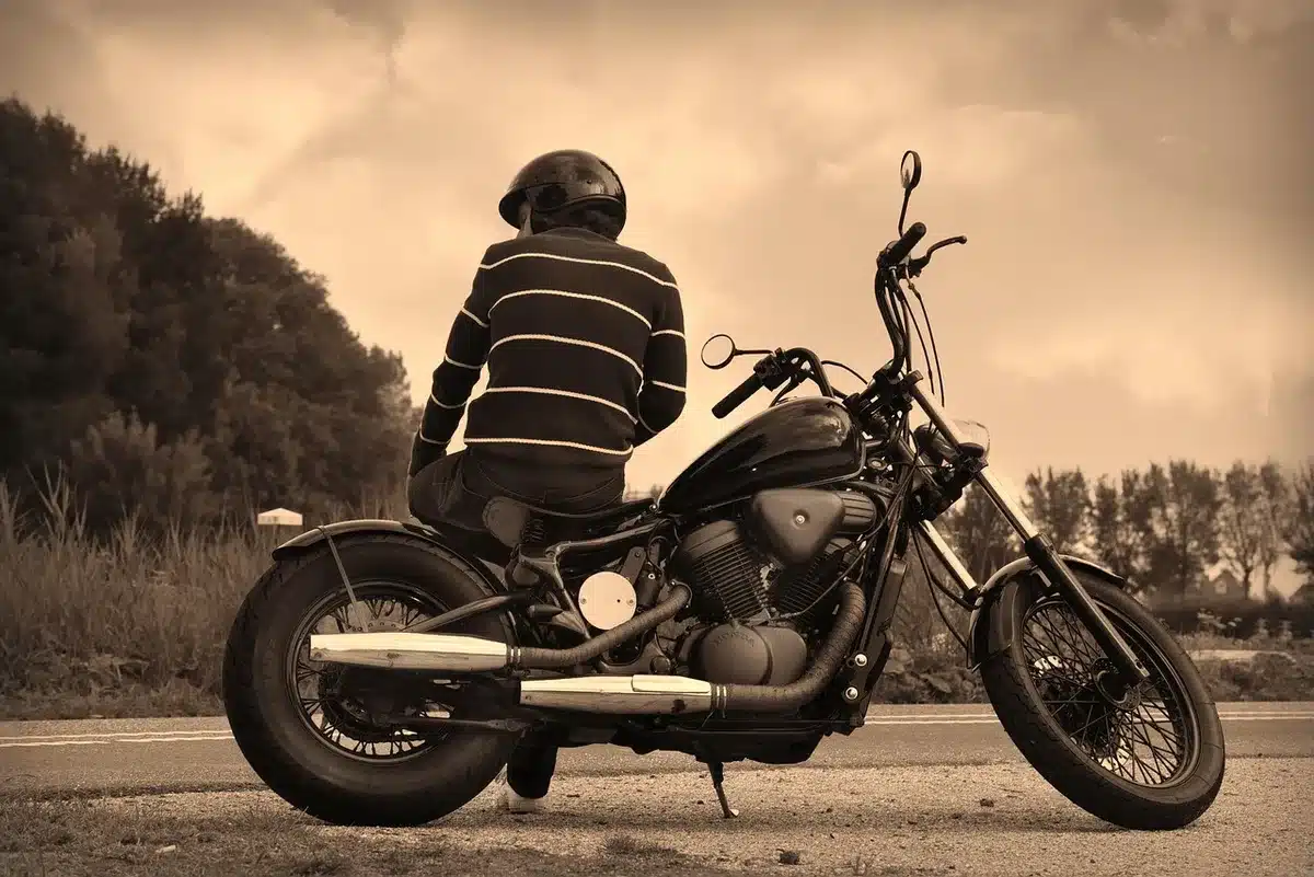 Motorcyclist scanning a QR code on a phone to join a group