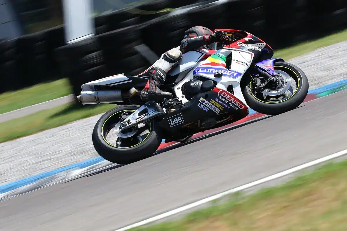 Lydden Hill circuit with parked bikes and fans celebrating an anniversary