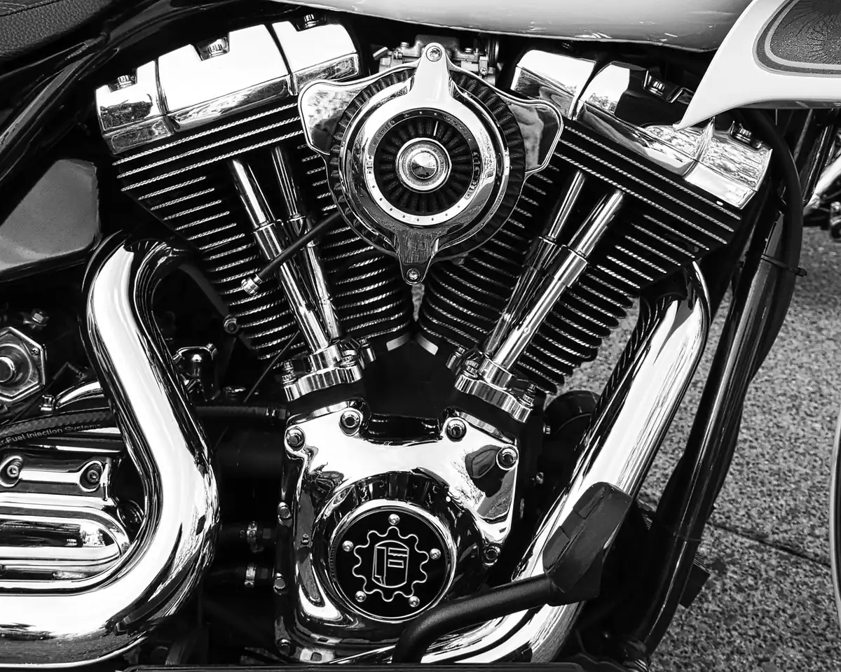 Close-up of a small parallel-twin motorcycle engine on a naked bike