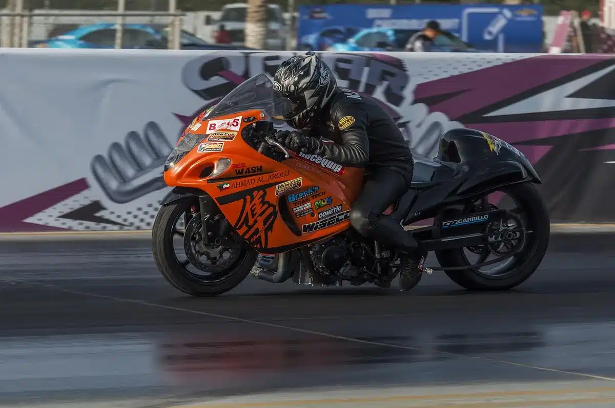 Elimination rounds staged at a dragstrip with two cars ready at the line