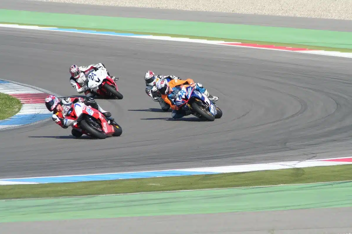 Sportbike leaning into a corner on a racetrack showing rapid turn-in