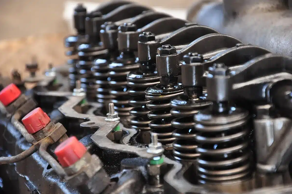 Mechanic inspecting suspension and welds during a buyer checklist