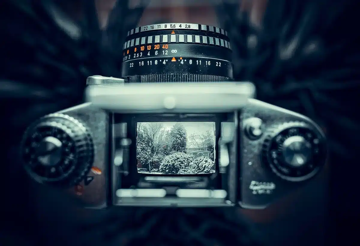 Close detail of an optical adapter with two mirrors mounted in front of a cine lens